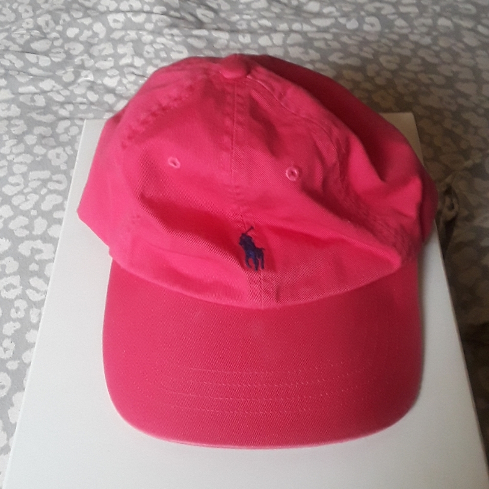 Hot pink polo hat with blue logo